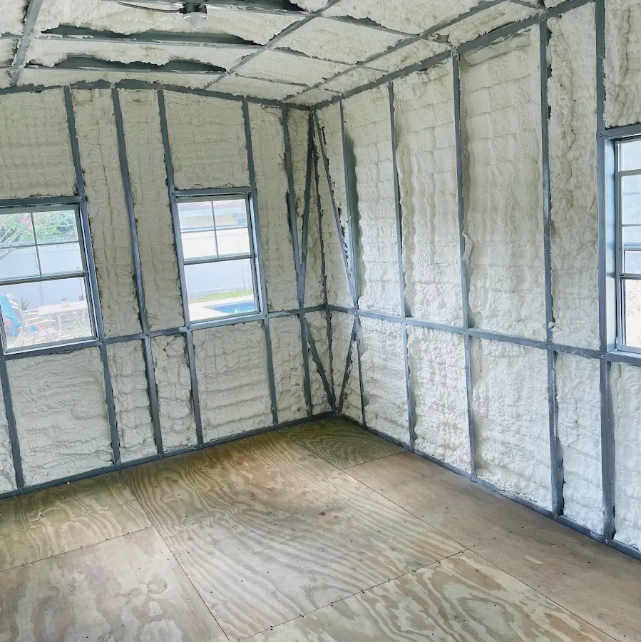 Closed-cell spray foam insulation applied to wall cavities in a residential project in Galliano